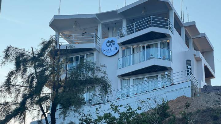 Sea Cliff hotel's white clifftop façade with wraparound balconies